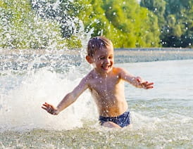 boy splashing in river