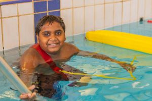 boy in pool with rescue tube at Goldfields Spirit Carnival