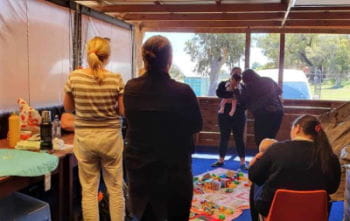 A group of women with babies at a Heart Beat Club presentation