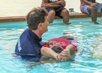 aquatic instructor demonstrating in pool