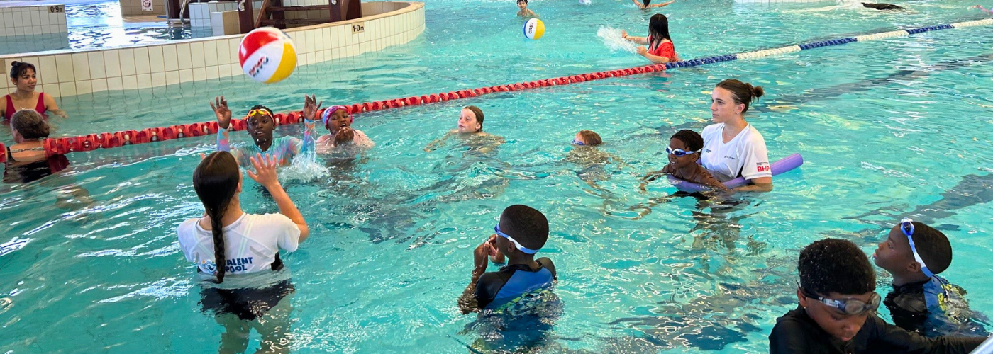 People play volleyball in the pool