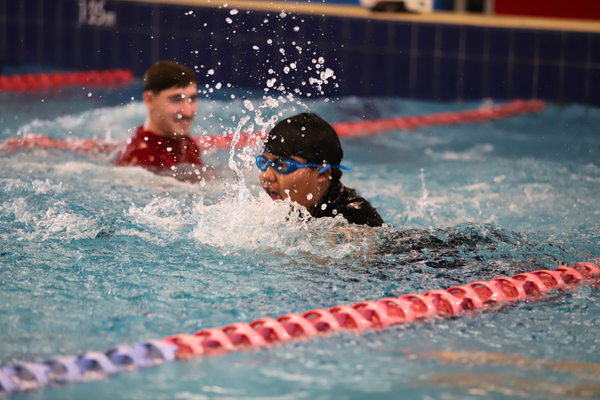 Action shot of a boy swimming breastroke