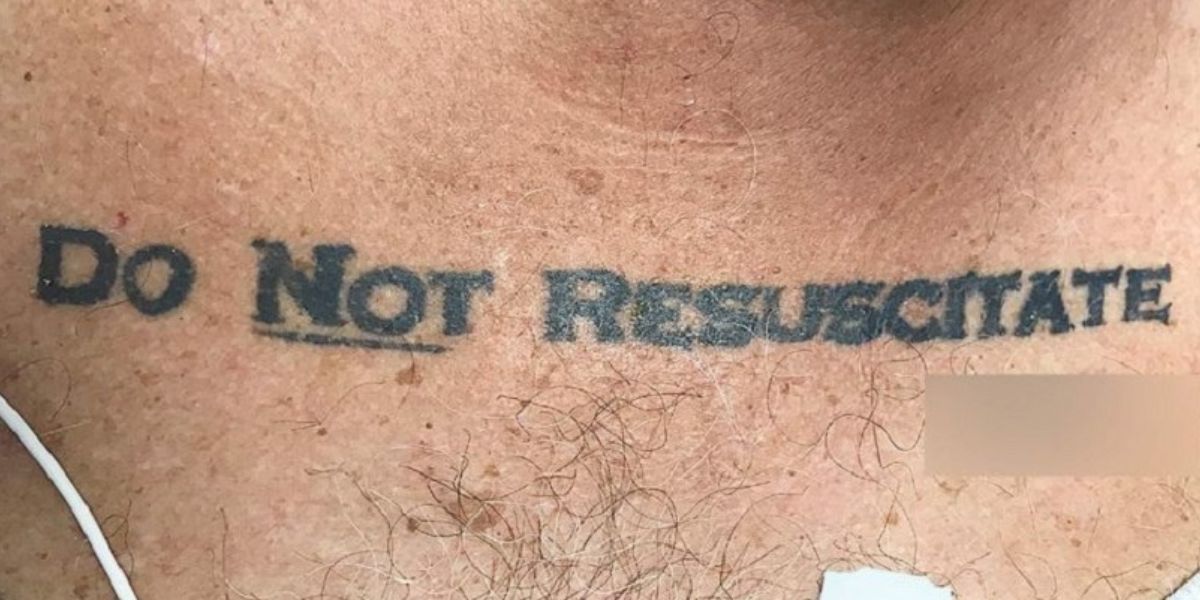 Do Not Resuscitate tattoo on chest with blurred area over signature