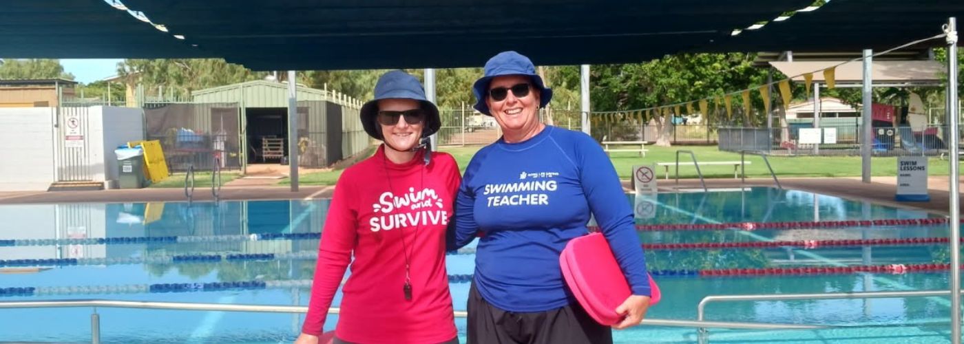 Royal Life Saving WA instructors stand in front of the pool