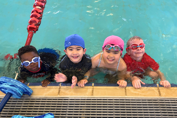 Karlgoorlie-T1-2025-Additional-1_2024_600x400.png Kids smile up at the camera from the edge of the pool