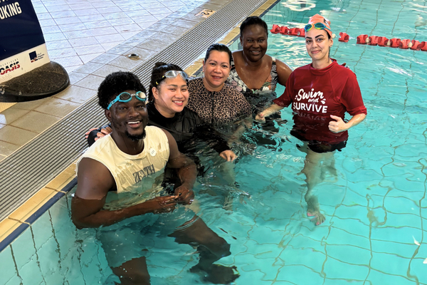 Karlgoorlie-T1-2025-Additional-2_2024_600x400.png Adult students and their instructor stand in the water