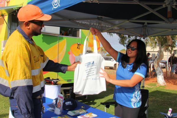 FeNaCING-additional_2025_600x400-3.jpg Aariane handing out a Make the Right Call tote bag
