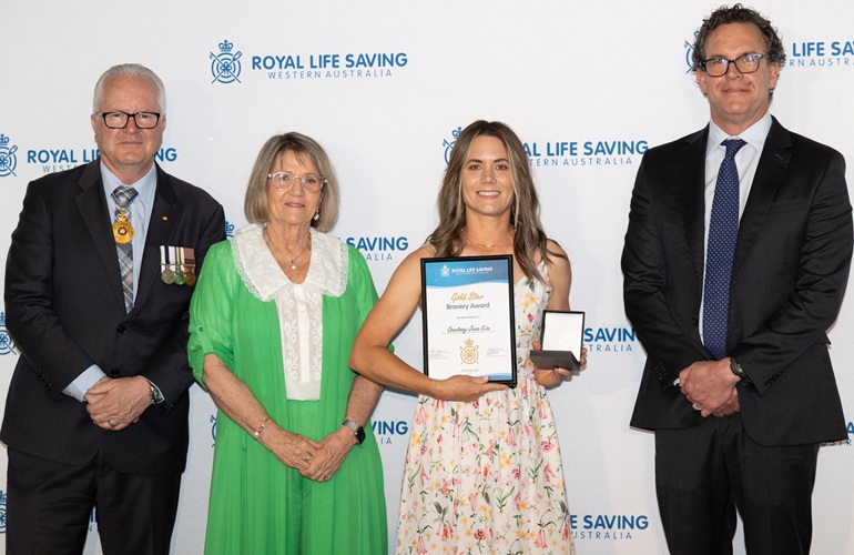 Courtney Kim being presented with her Bravery Award