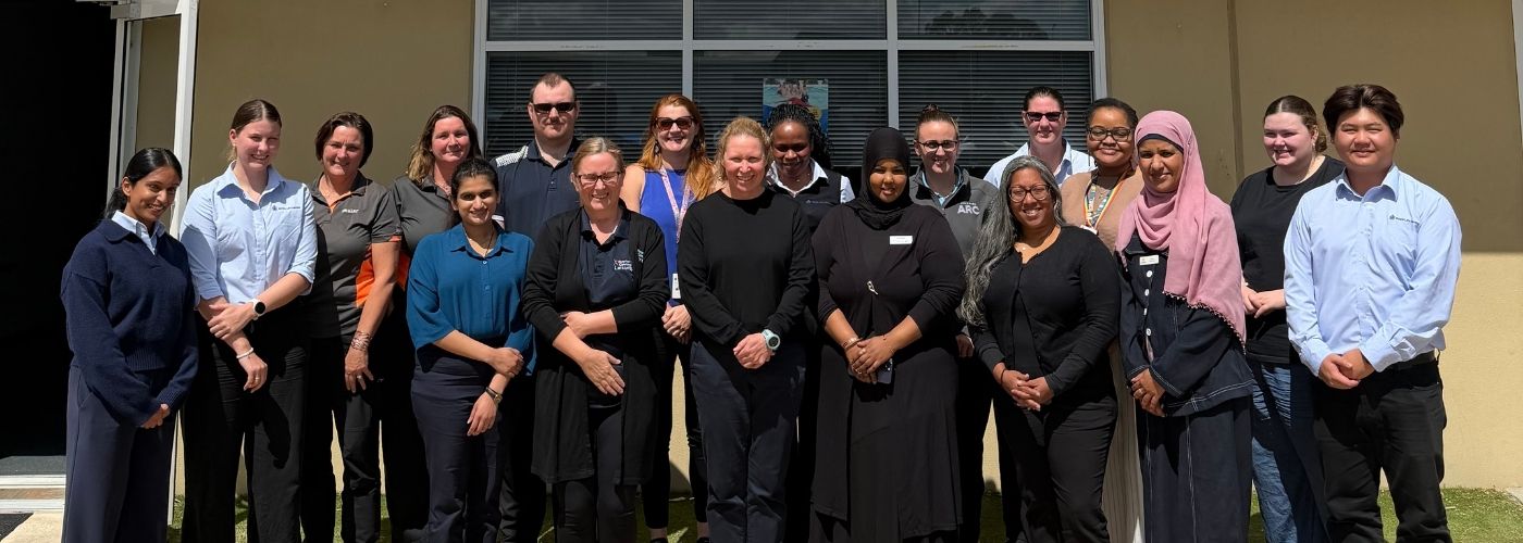 Members of Royal Life Saving WA&rsquo;s Multicultural Steering Committee standing together outside Royal Life Saving WA Head Office