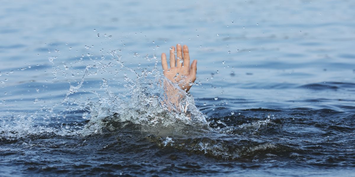 hand reaching out of the water