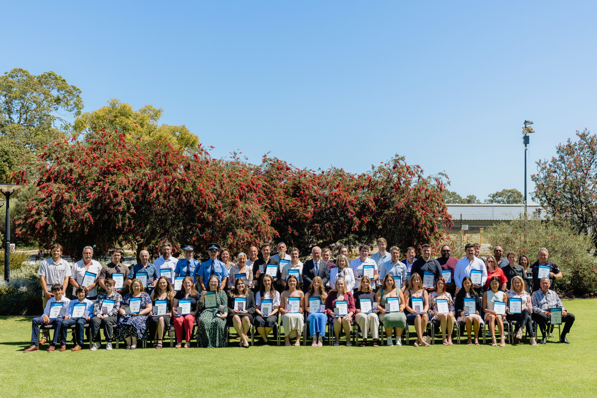 Bravery Award Recipients stand together in a large group