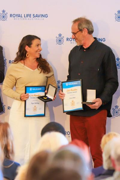 Taryn Delestang and David Hobbs receiving their awards