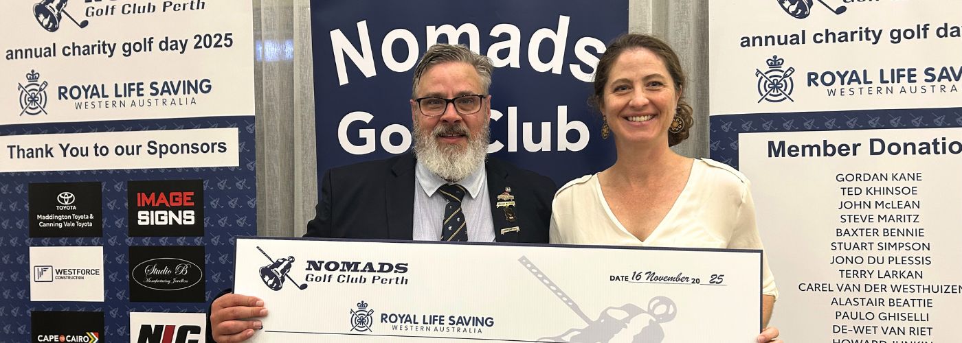 Two people holding giant cheque reading $10,000
