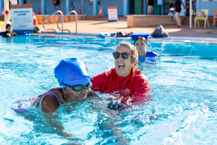 swimming instructor with adult female students
