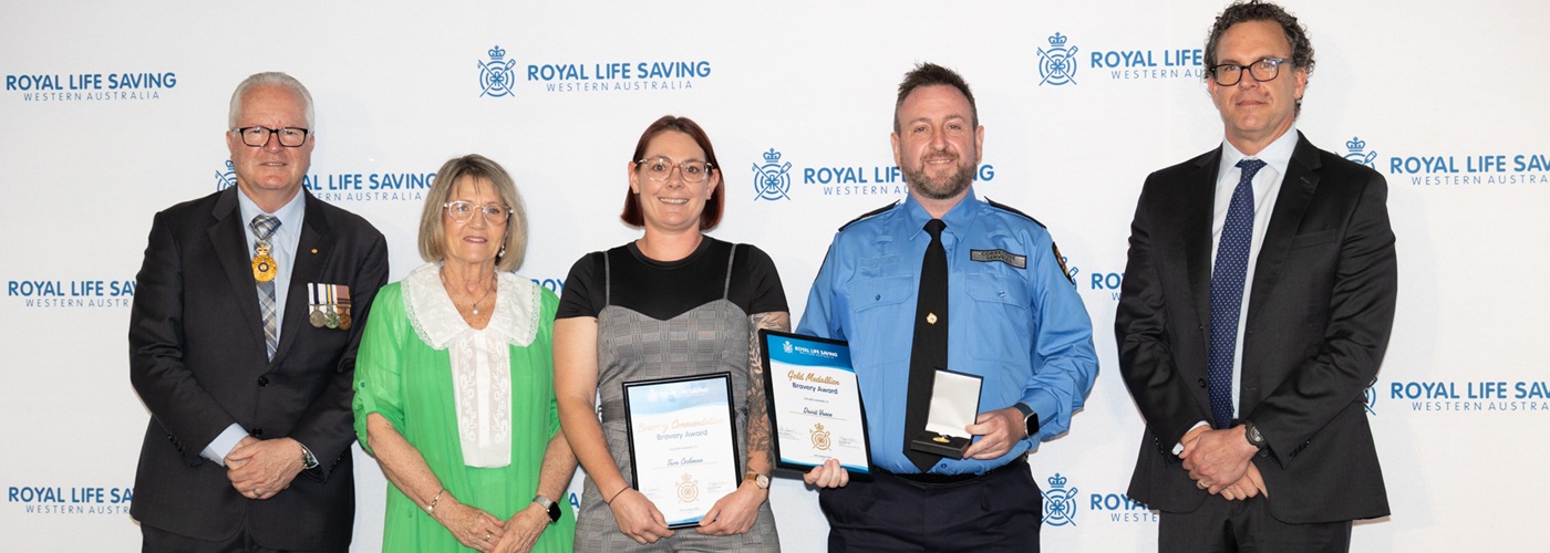 Tara Cockman and David Vance holding their Bravery Awards