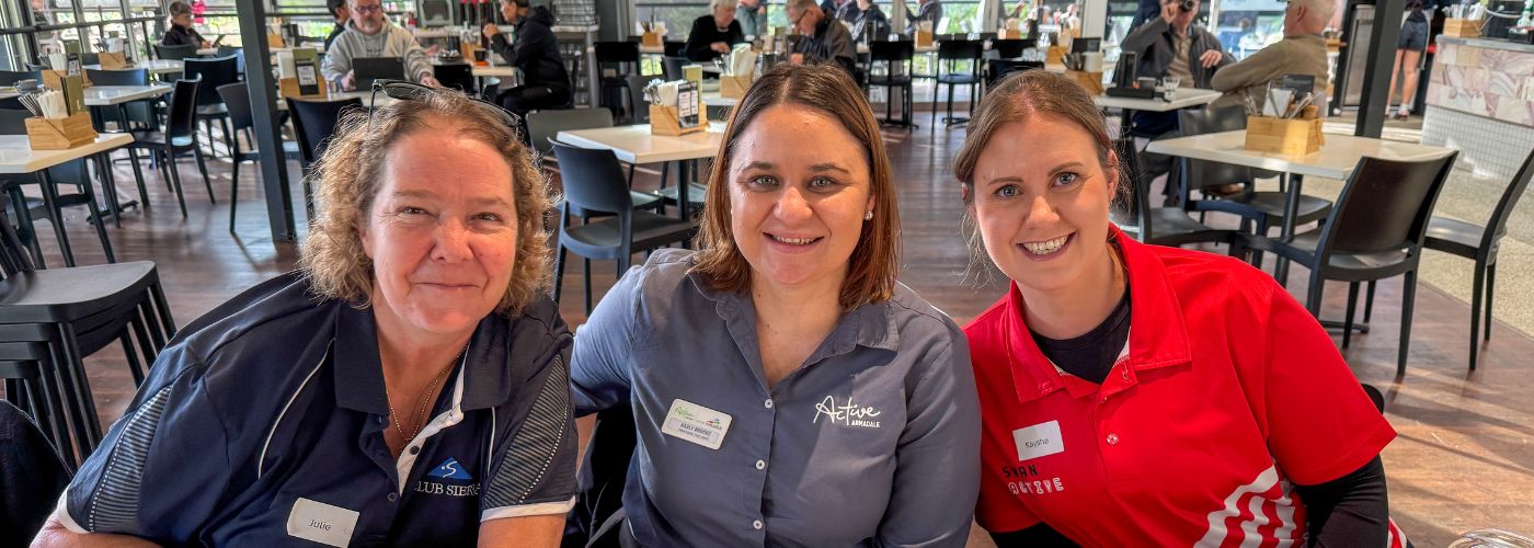 three trainers smiling at the EOFY recognition event