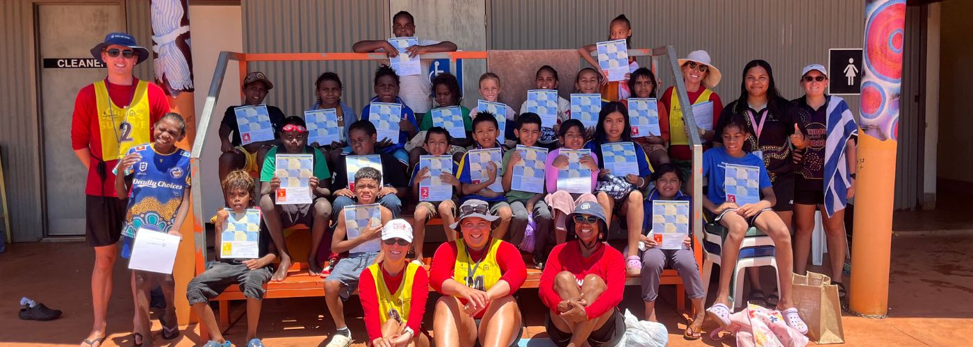 Group photo with instructors and students posing with certificates