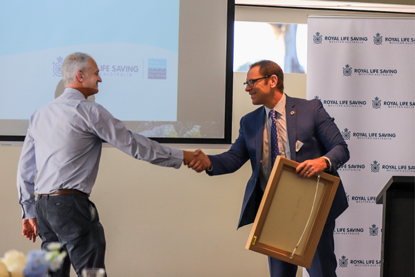 Ian shaking Royal Life Saving WA CEO Peter Leaversuch's hand
