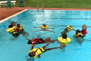 Jigalong kids practising lifejacket skills at the Jigalong pool