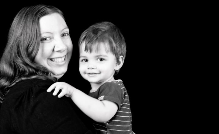 Black and white photo of mother melanie holding her 3 year old son Lachlan