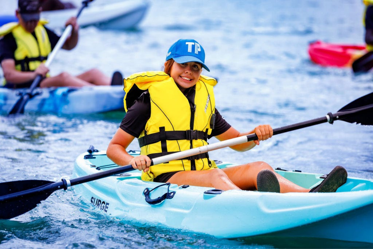 Girl kayaking in lifejacket