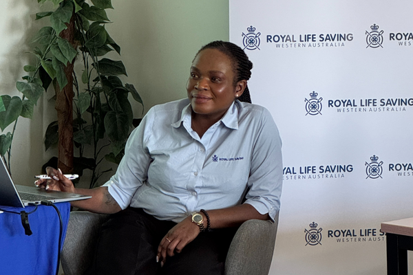 A Royal Life Saving WA Inclusion Manager listens to presentations given to the Committee