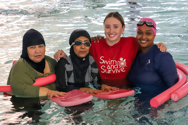 multicultural women learning to swim