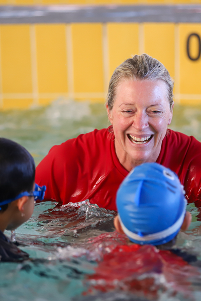 Geraldton swimming instructor smiling at students