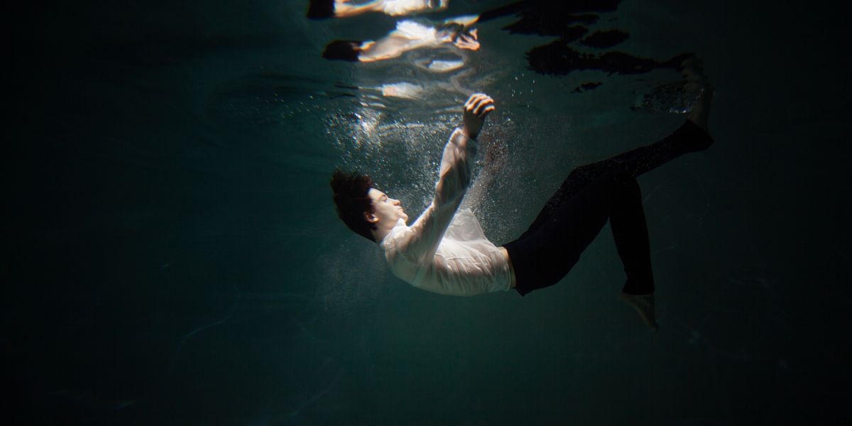Person submerged underwater