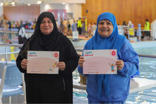 multicultural women learning to swim