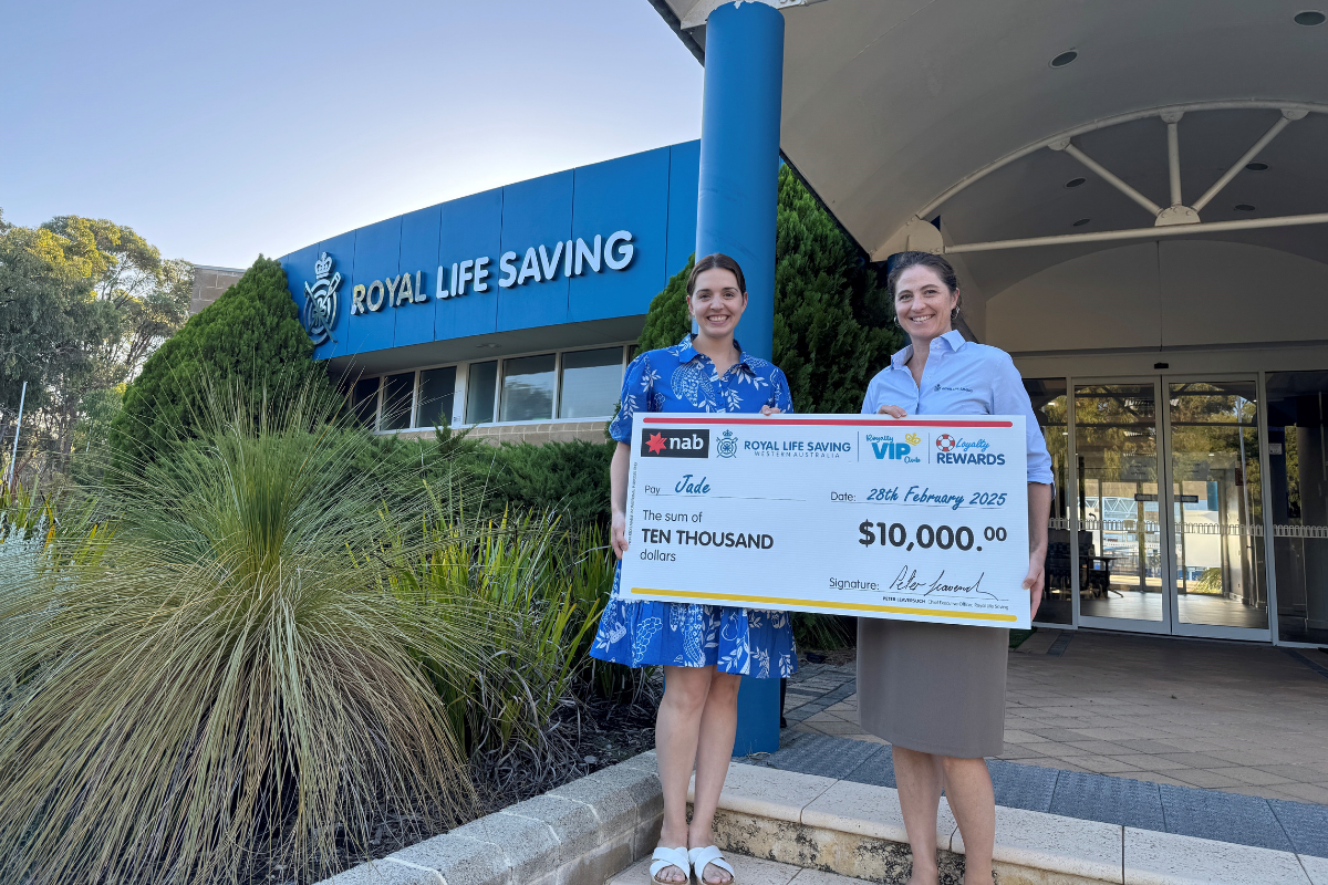 A Royal Life Saving WA raffle winner with their check